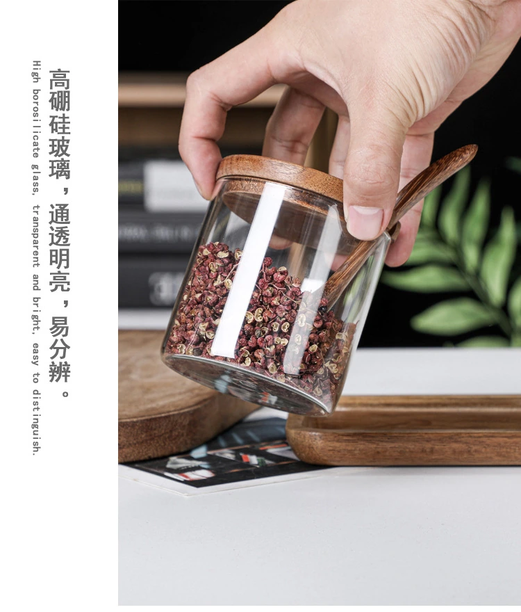 Single transparent glass seasoning jar with a wooden lid and spoon, supplier image with material annotation
