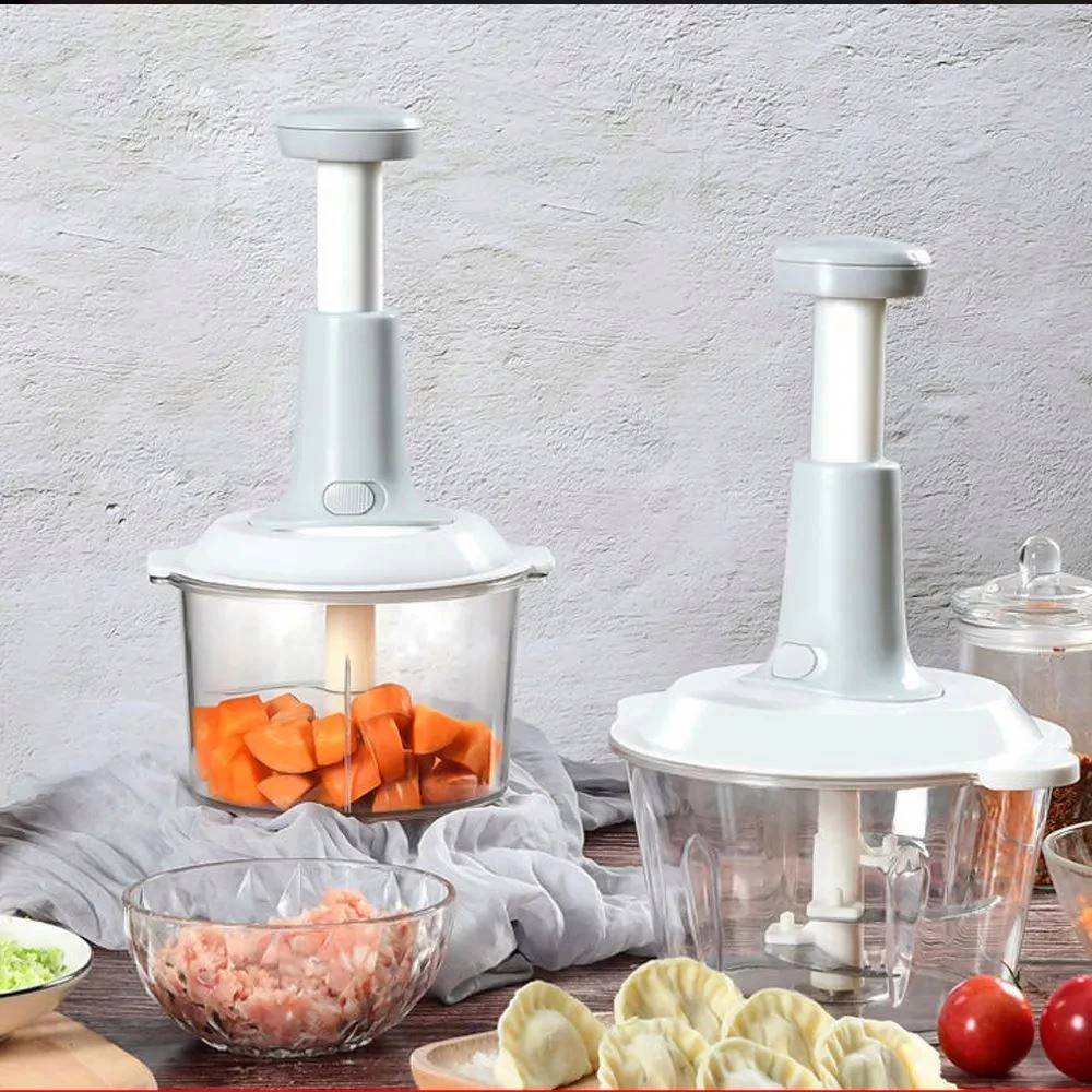 Two white hand-push onion choppers with transparent bowls beside prepared vegetables